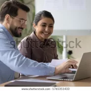 smiling-diverse-colleagues-working-on-600w-1765351433